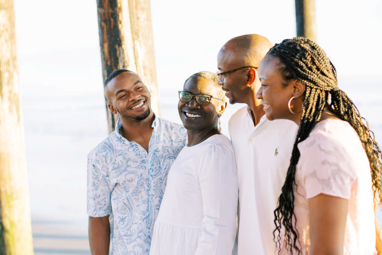 family laughing together on the beach enjoying a JAJF late stage cancer timeout 