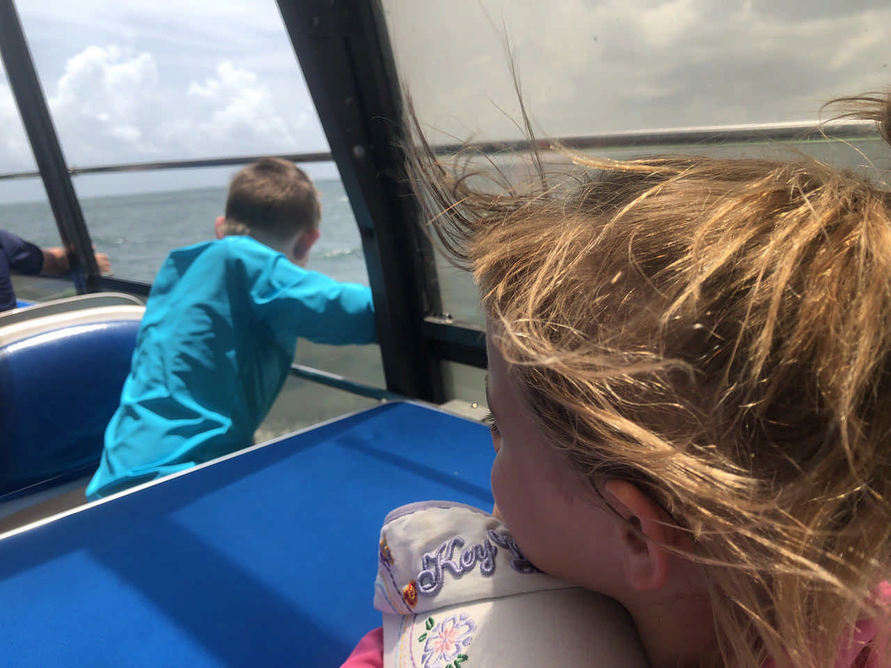 children looking at the water on a boat during a JAJF late stage cancer timeout 