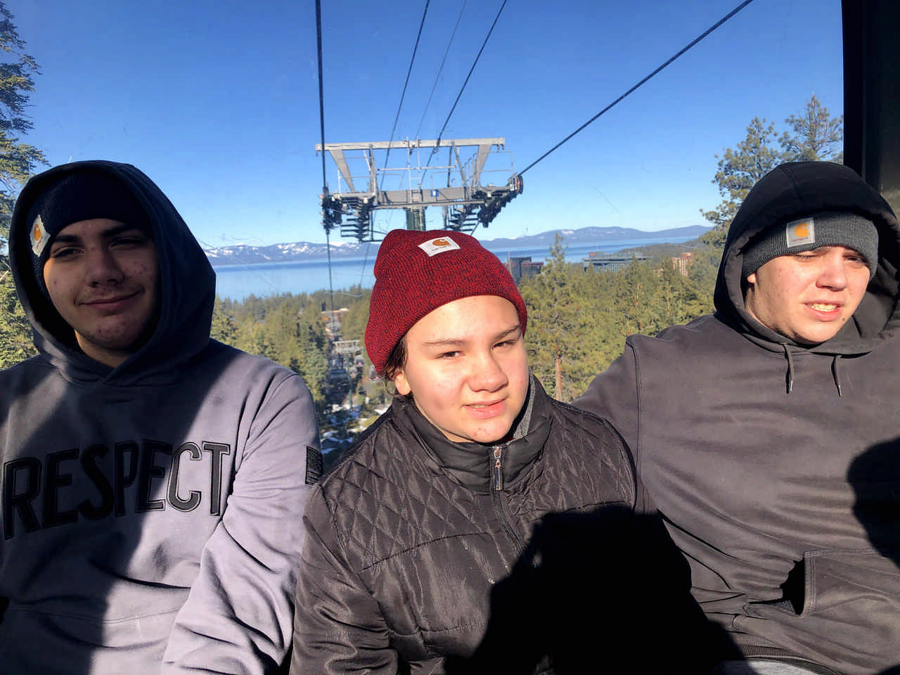 siblings on a ski lift enjoying a JAJF late stage cancer timeout 