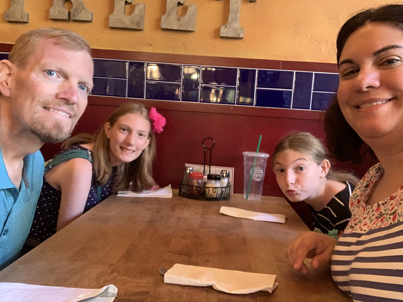 family eating in a restaurant during a JAJF late stage cancer timeout 