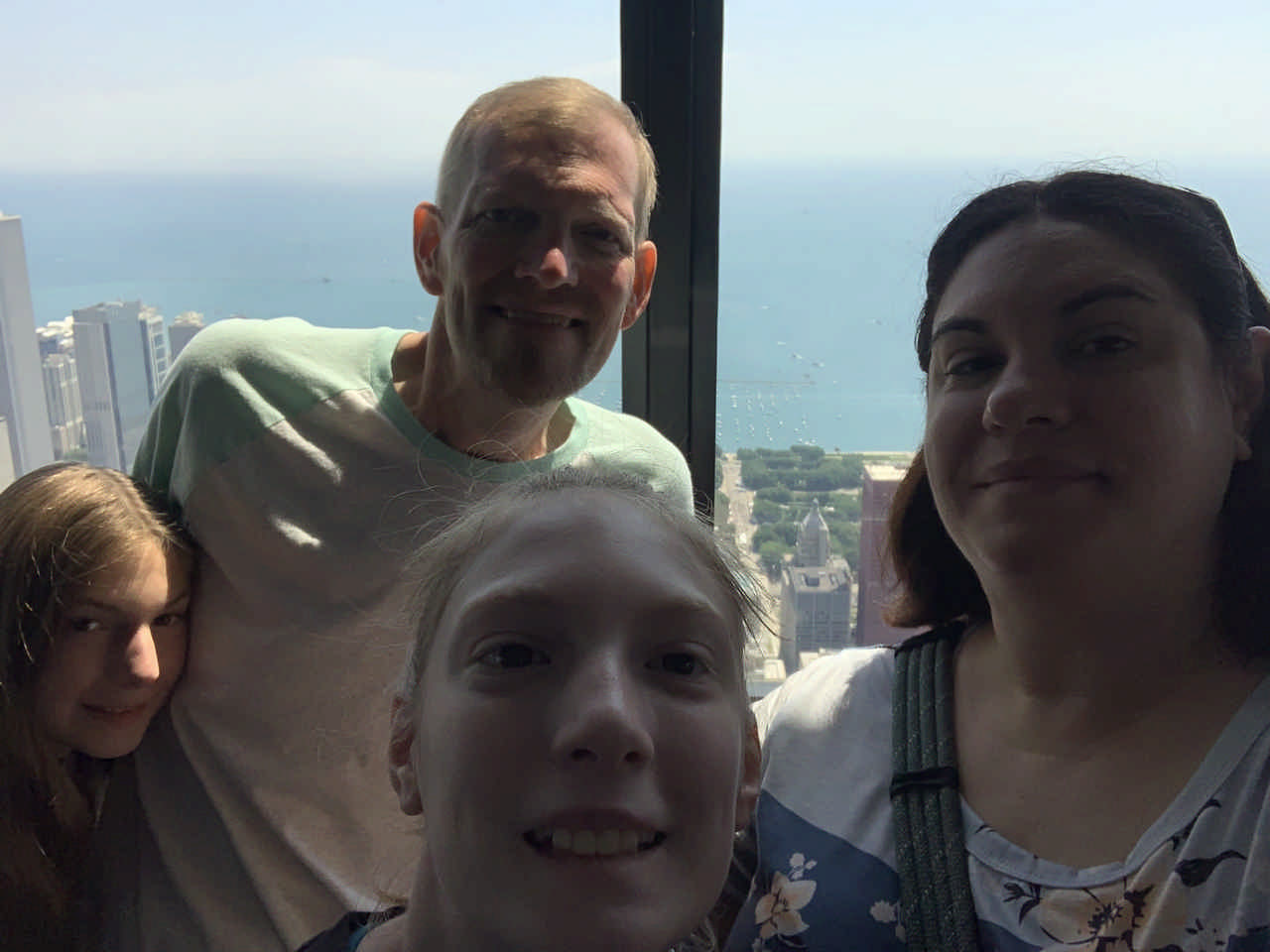 family selfie in skyscraper overlooking Chicago during JAJF late stage cancer timeout 