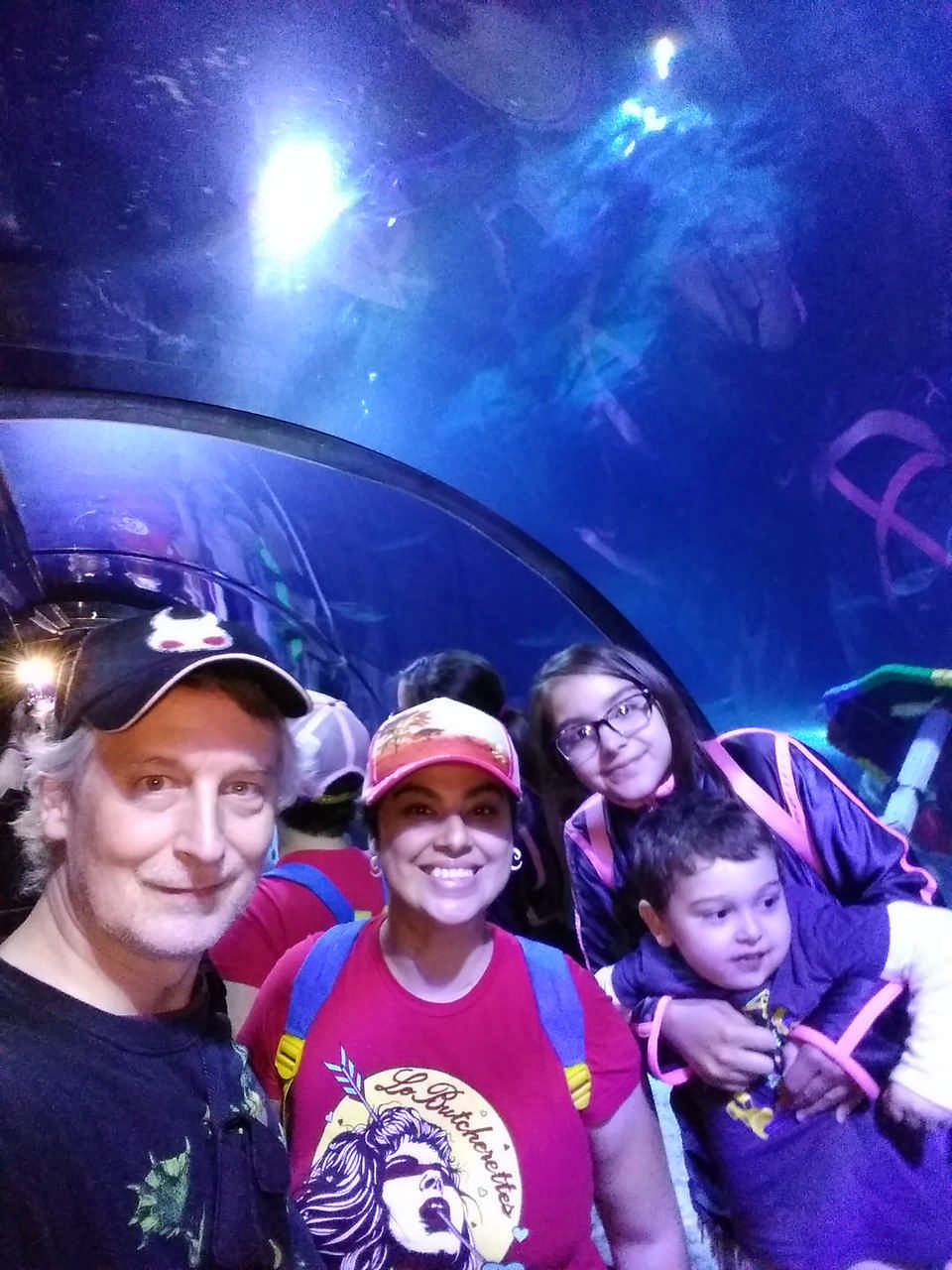 family in aquarium tunnel on a JAJF late stage cancer timeout 