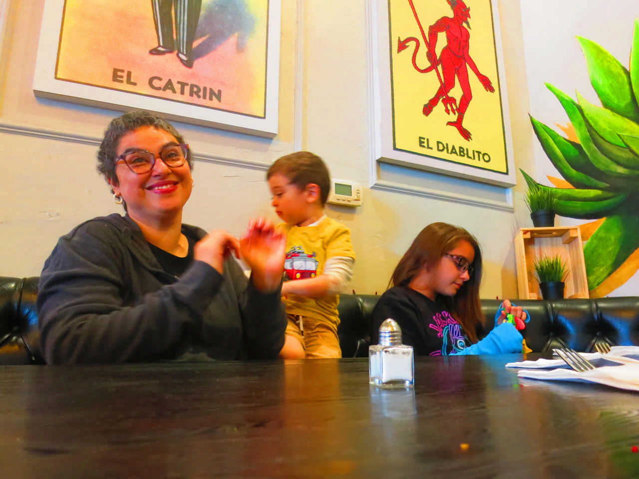 mom with children at restaurant during a JAJF cancer timeout 