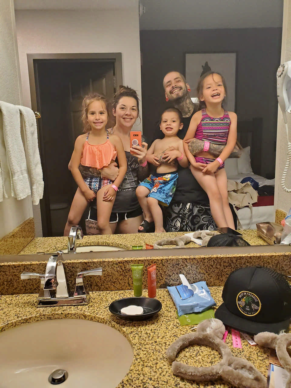 family selfie in hotel bathroom mirror during a JAJF cancer timeout 