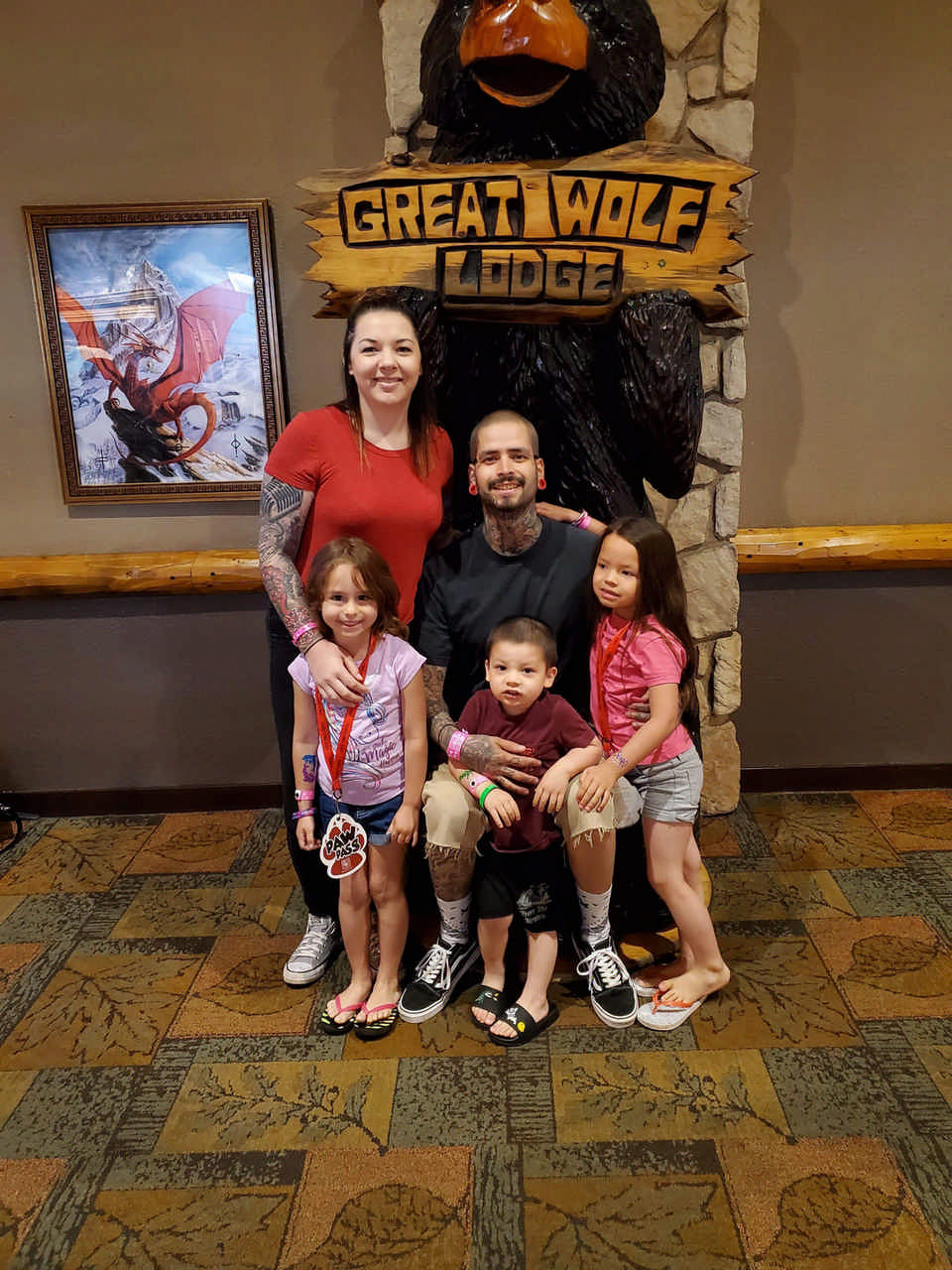 family posing at Great Wolf Lodge sign during JAJF cancer timeout 
