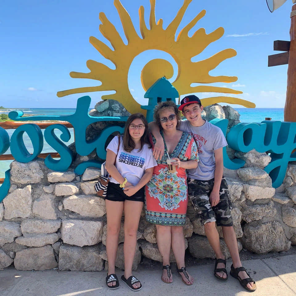 family at Costa Cay sign during a Jack and Jill Foundation WOW experience 