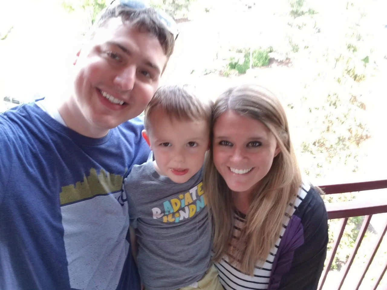 family on hotel balcony enjoying a JAJF WOW experience 