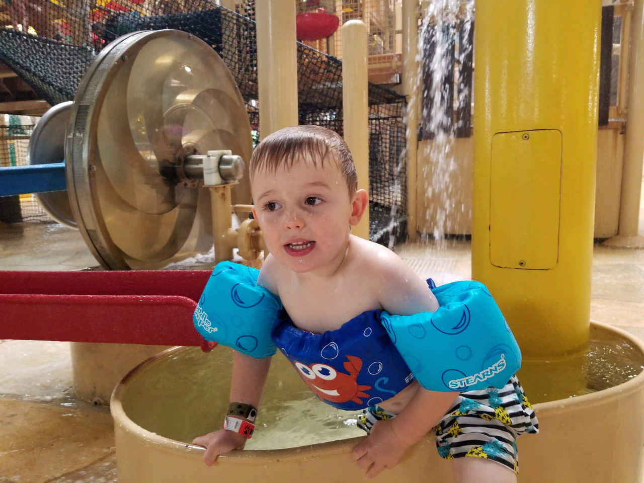 toddler boy in water park enjoying a Jack and Jill Foundation WOW experience 