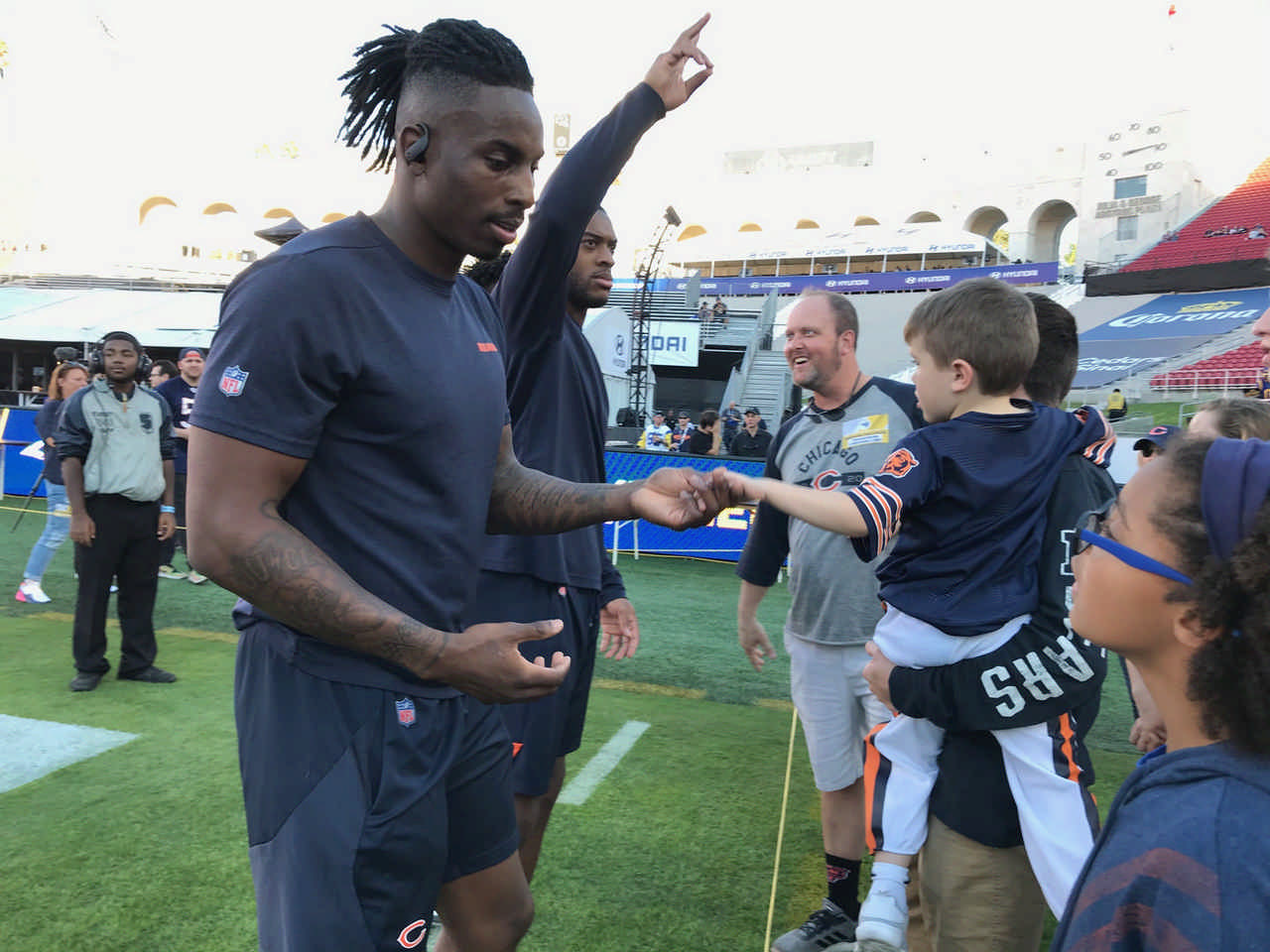 kids meeting Chicago Bears football players on JAJF WOW experience 