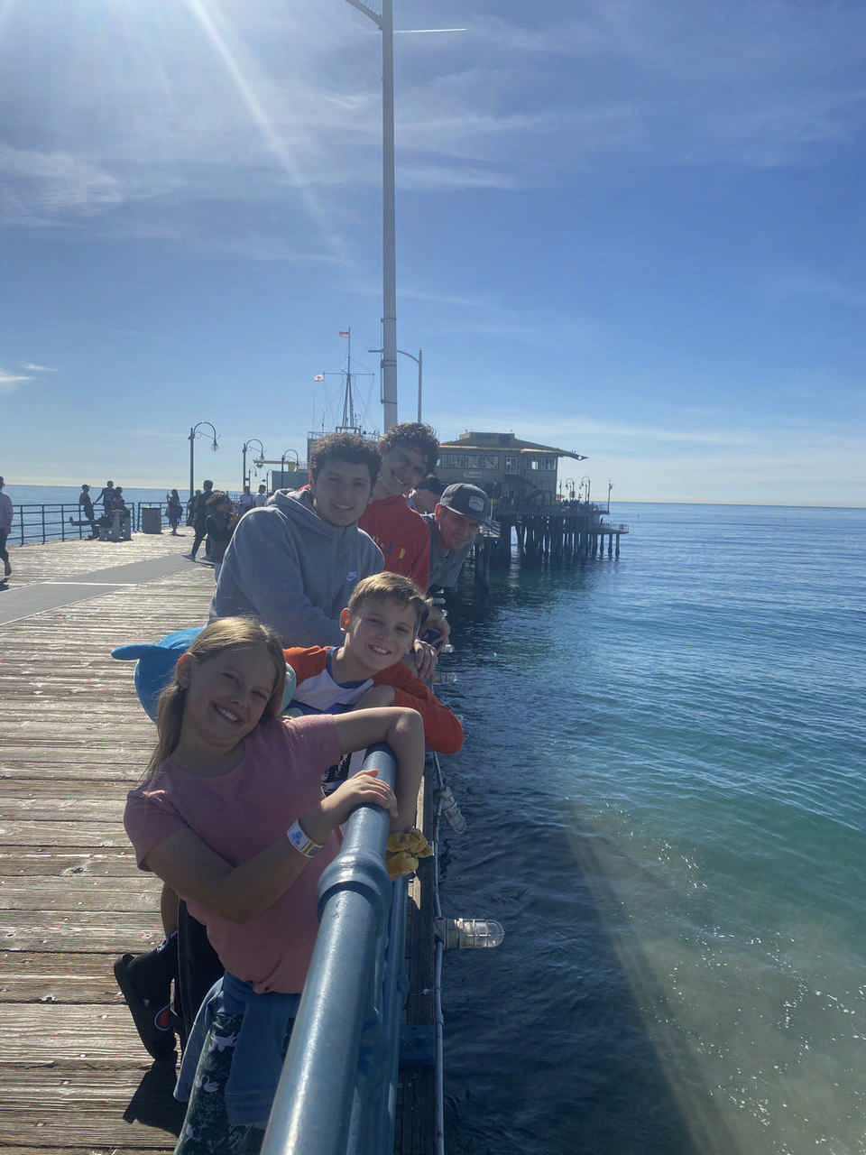 family posing on a pier over the water during a Jack and Jill Foundation WOW experience 