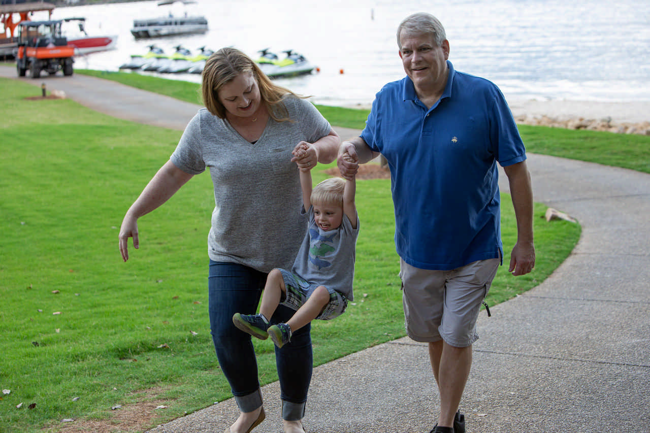 couple swinging toddler between them during a Jack and Jill Foundation WOW experience 