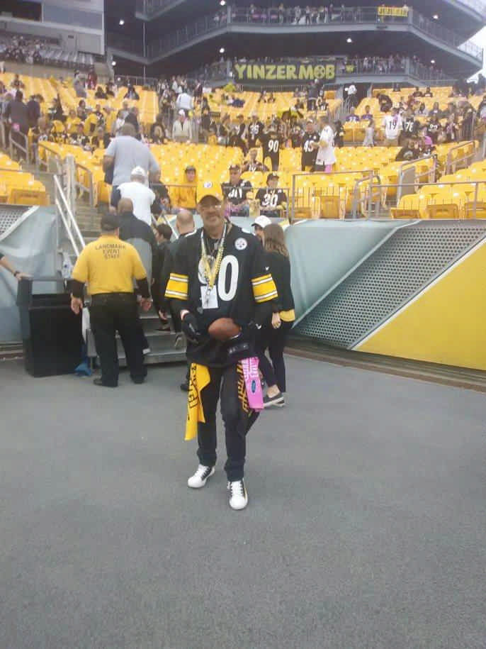 man dressed up in Pittsburgh Steelers gear during a JAJF WOW experience 