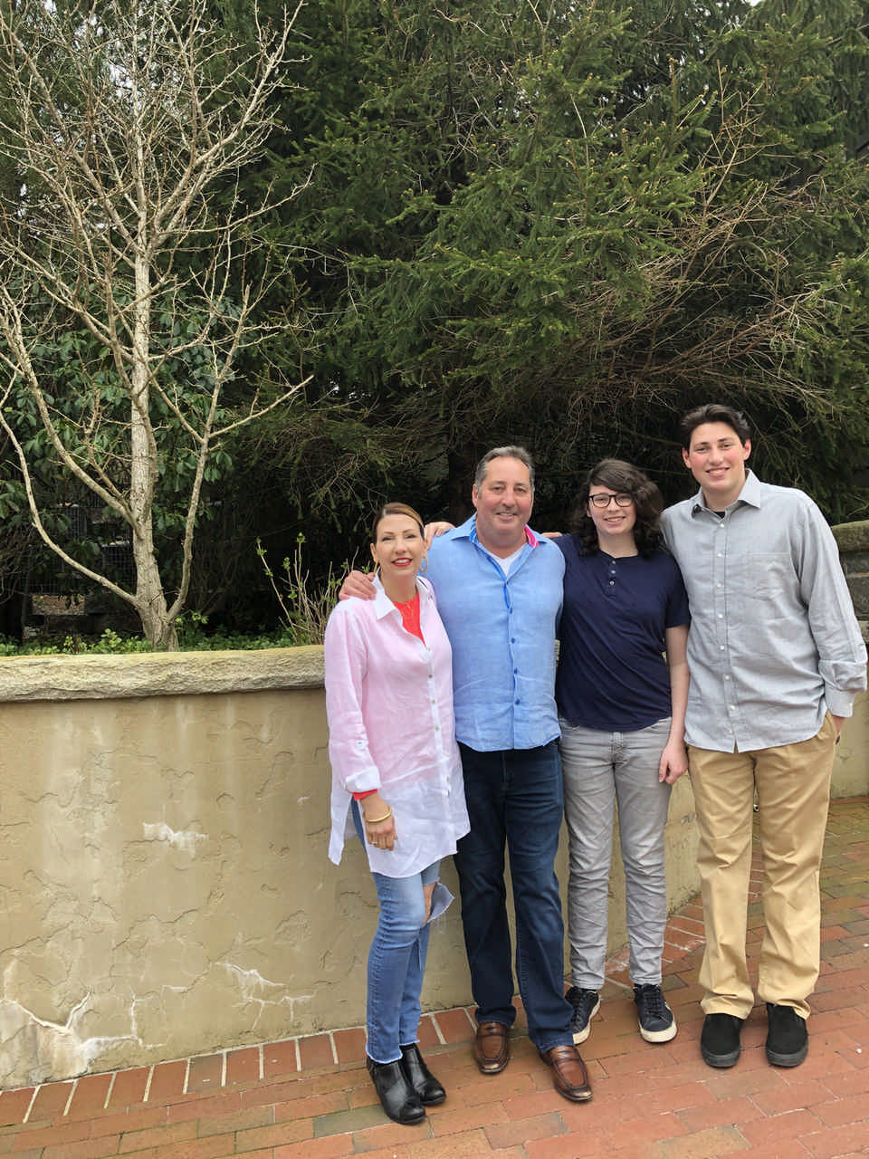 family arm in arm outside during a Jack and Jill Foundation WOW experience 