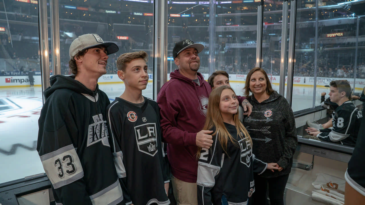 family beside LA King hockey rink enjoying a JAJF WOW experience 