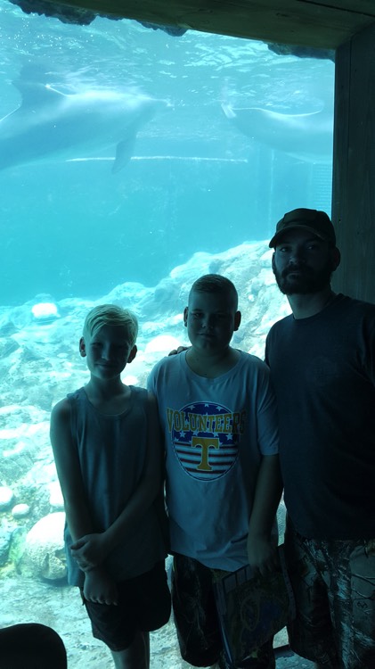 JAJF father and sons at aquarium taking a late stage cancer timeout 