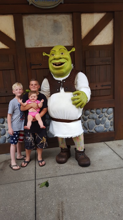 JAJF young boys holding baby sister with Shrek character experiencing the power of WOW 
