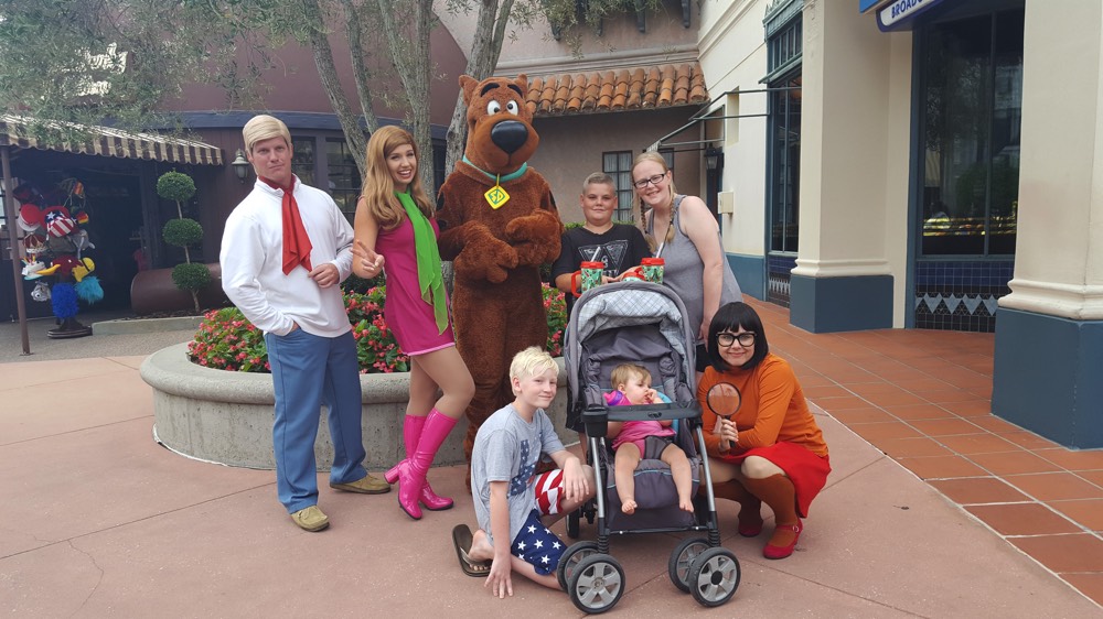 family with Scooby Doo characters on a JAJF WOW experience 