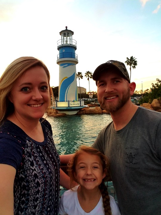 couple with daughter on boardwalk enjoying The Power of WOW experience 