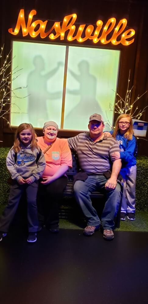 couple with daughters enjoying The Power of WOW experience 