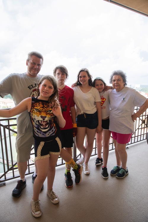 JAJF family on hotel balcony enjoying a WOW experience 