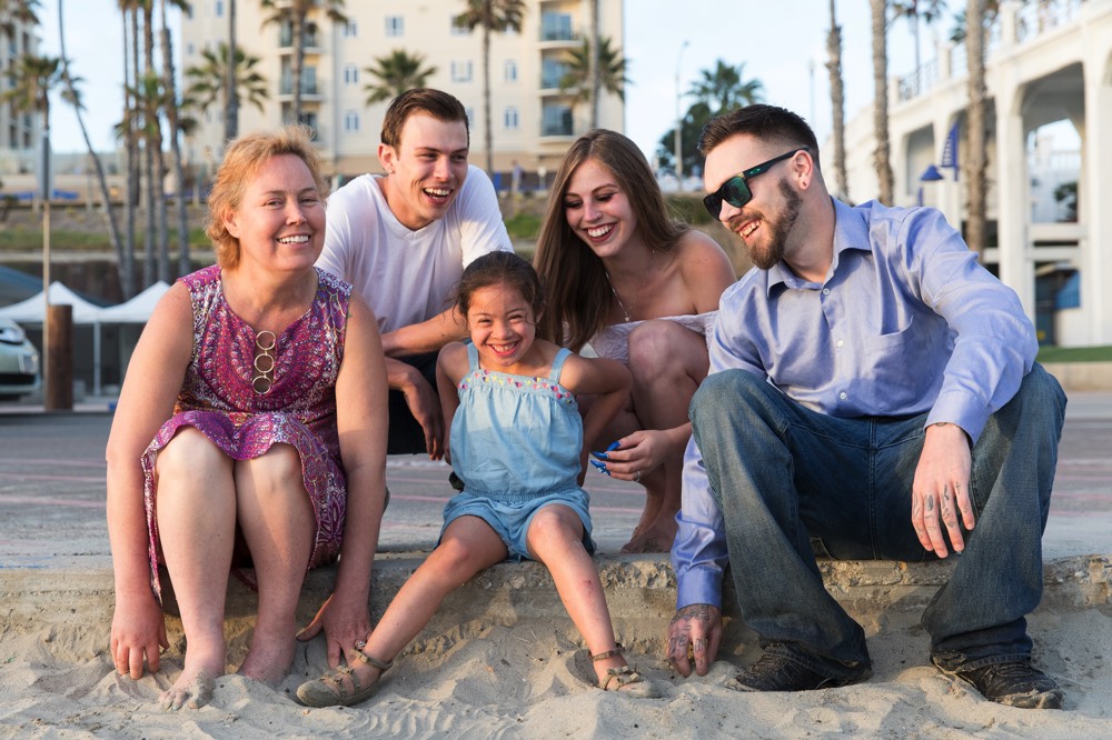 family on beach on a JAJF WOW experience 