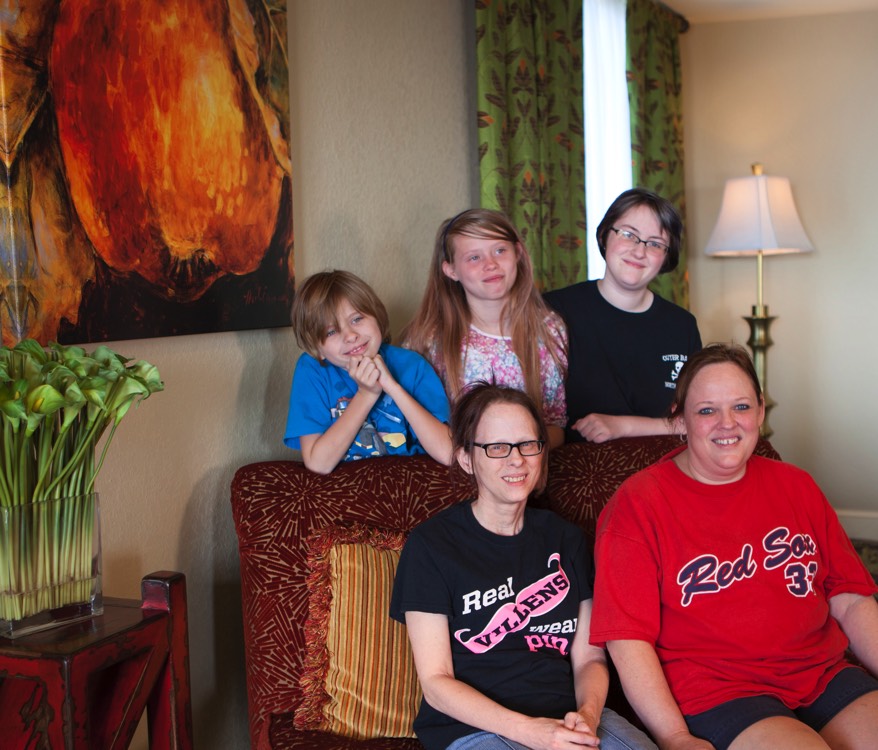 JAJF family on sofa in hotel room enjoying the WOW experience 