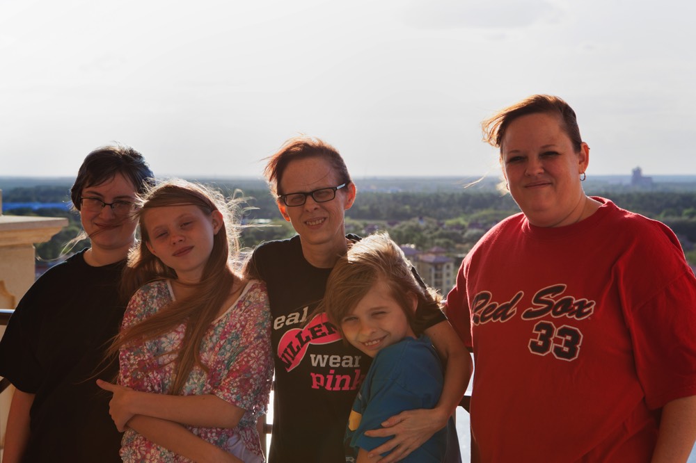 JAJF family on hotel balcony enjoying a WOW experience 