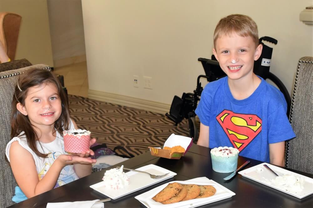 brother and sister enjoying The Power of WOW experience 