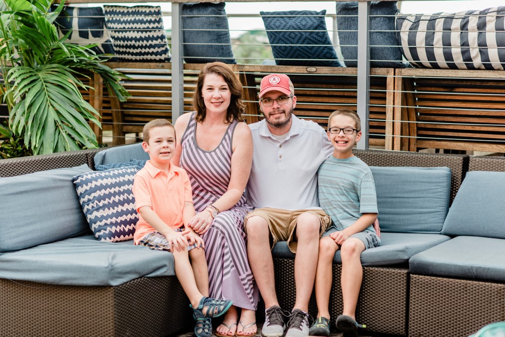 family on outdoor sofa on a JAJF WOW experience 