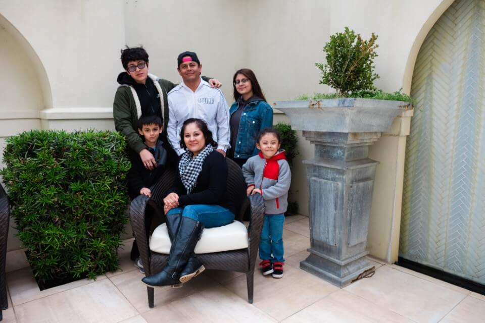 children posing with mother in chair enjoying The Power of WOW experience 