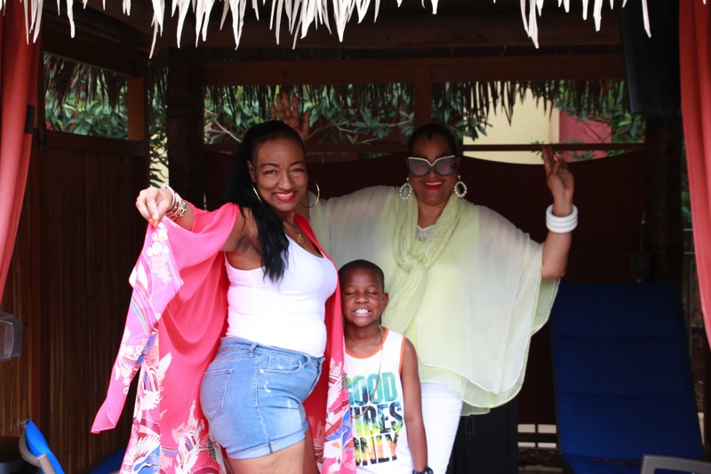 family in pool cabana enjoying a JAJF Wow Experience 