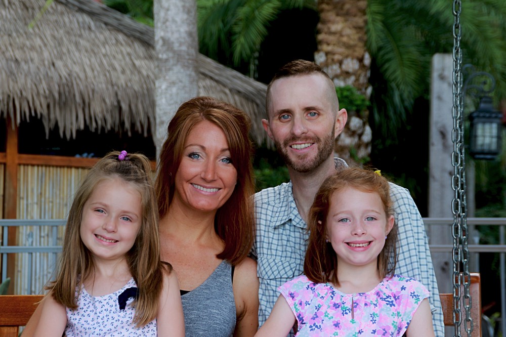 mom and dad with two young daughters during a JAJF trip treating the families not the cancer 