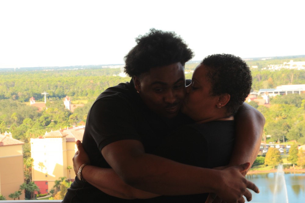 mom and son on hotel balcony on a JAJF WOW experience 