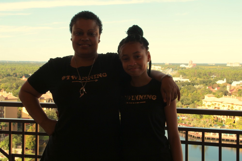 mom and daughter on hotel balcony on a JAJF WOW experience 