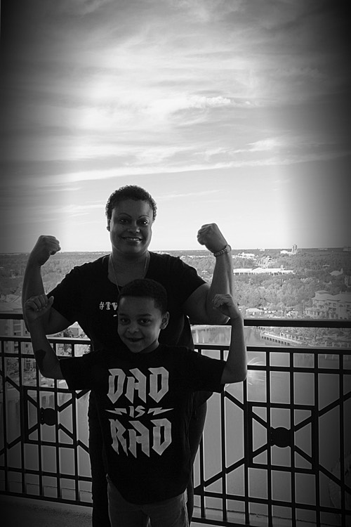 mom and son flexing their muscles on a JAJF WOW experience 