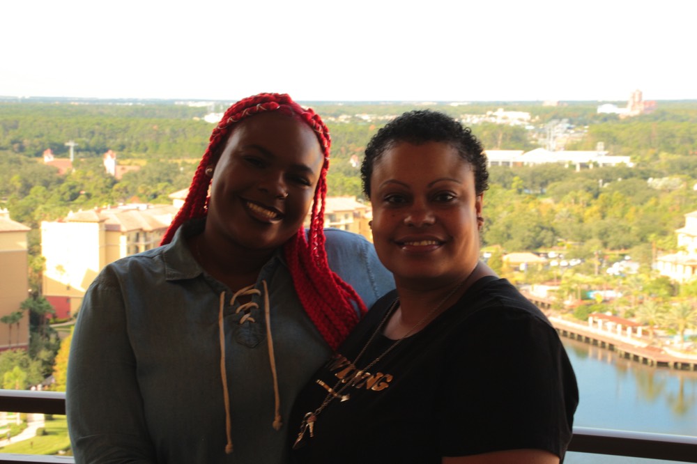 mom and daughter on hotel balcony on a JAJF WOW experience 