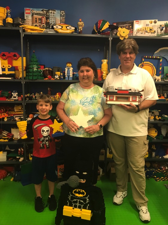 family with novelty items on a JAJF WOW experience 