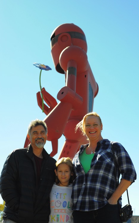 family in front of statue on a JAJF WOW experience 
