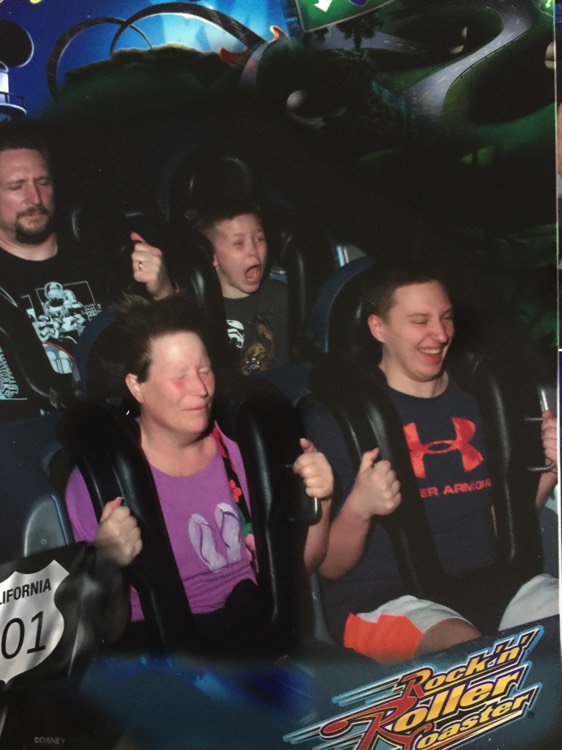 couple on roller coaster enjoying a JAJF WOW experience 