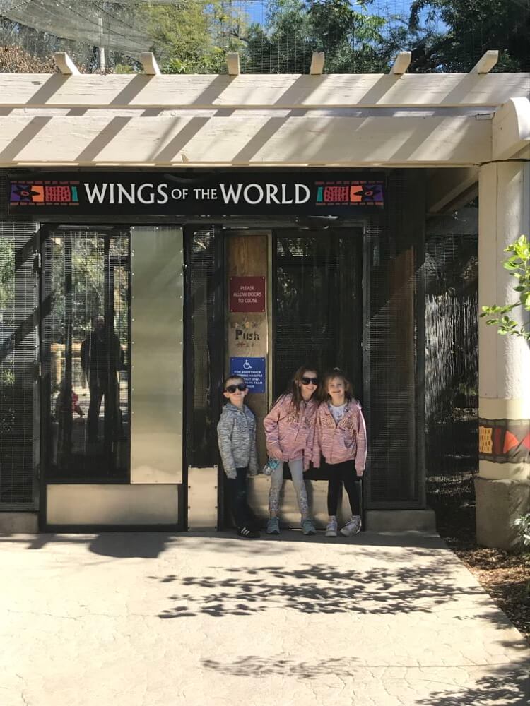 family outside Wings of the World building enjoying The Power of WOW experience 
