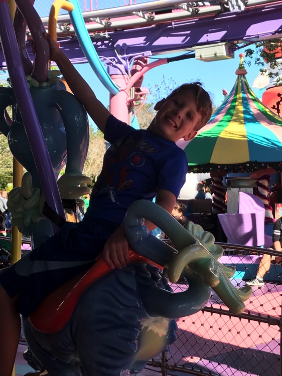 young boy at theme park on a JAJF WOW experience 