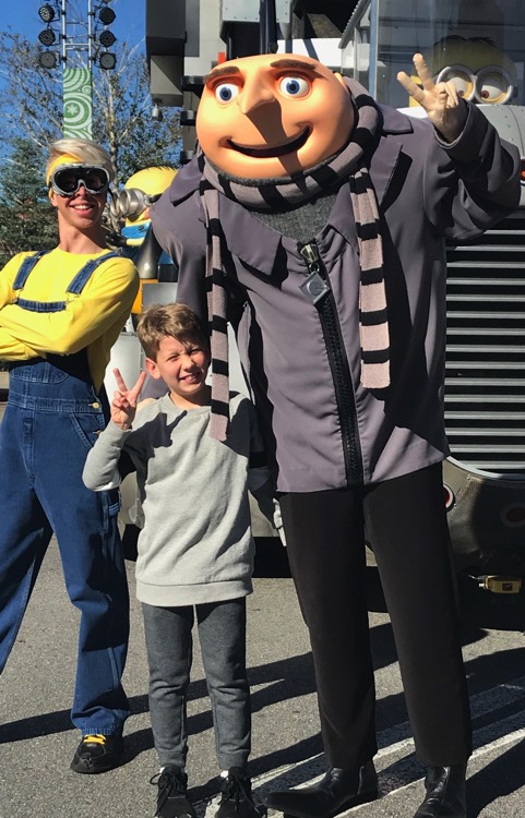 young boy holding fingers in peace sign on a JAJF WOW experience 