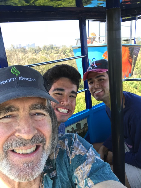 dad and sons taking selfie enjoying The Power of WOW experience 
