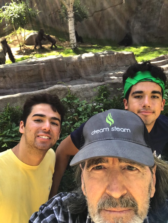 dad posing with sons for selfie enjoying The Power of WOW experience 