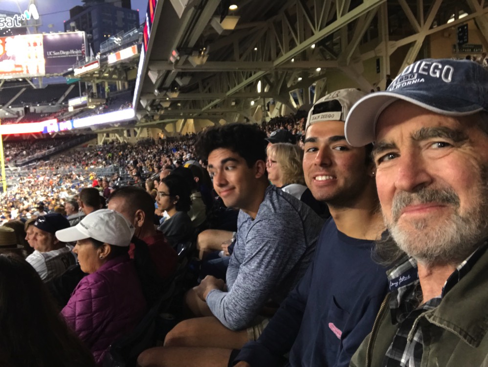 family at sporting event enjoying The Power of WOW experience 