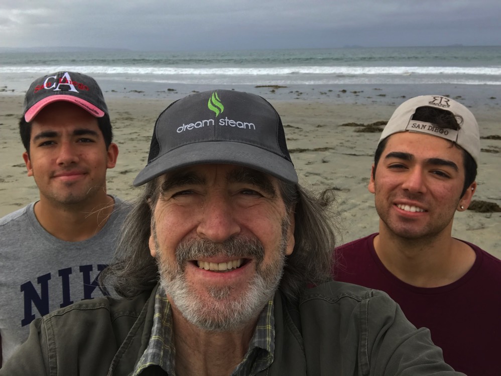 dad with sons posing for selfie enjoying The Power of WOW experience 