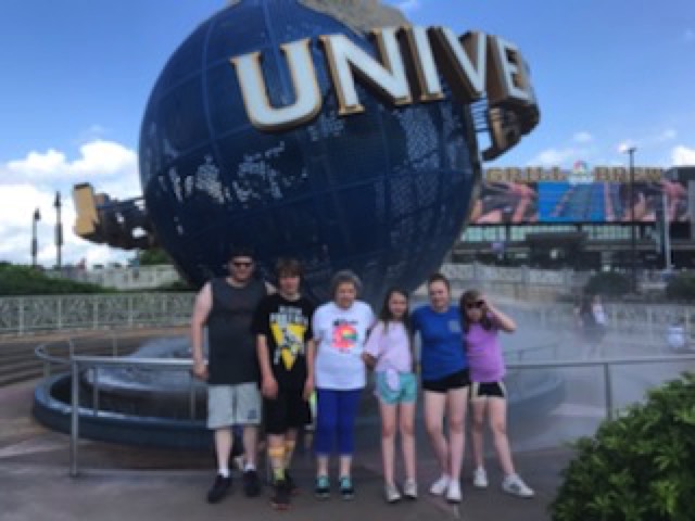 JAJF family in front of Universal Studios globe  