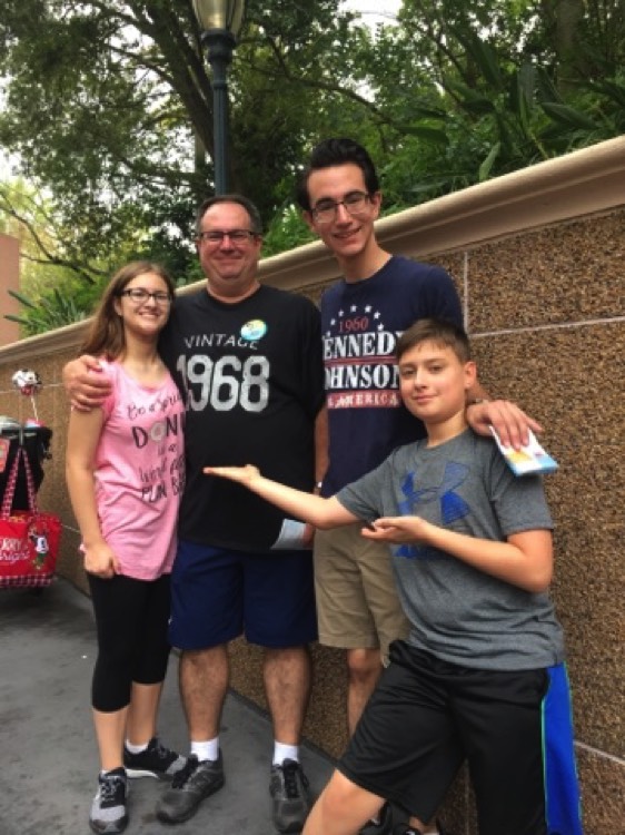 dad with children at Disney World on a JAJF WOW experience 
