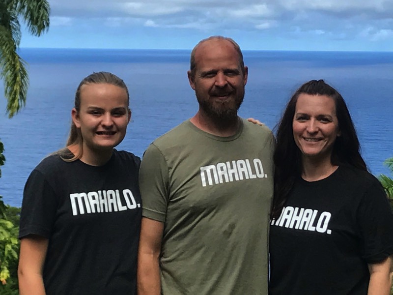 mom and dad with daughter at the beach enjoying a JAJF WOW experience 