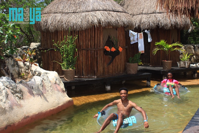 boy on blue inner tube going down lazy river enjoying a JAJF Wow Experience 